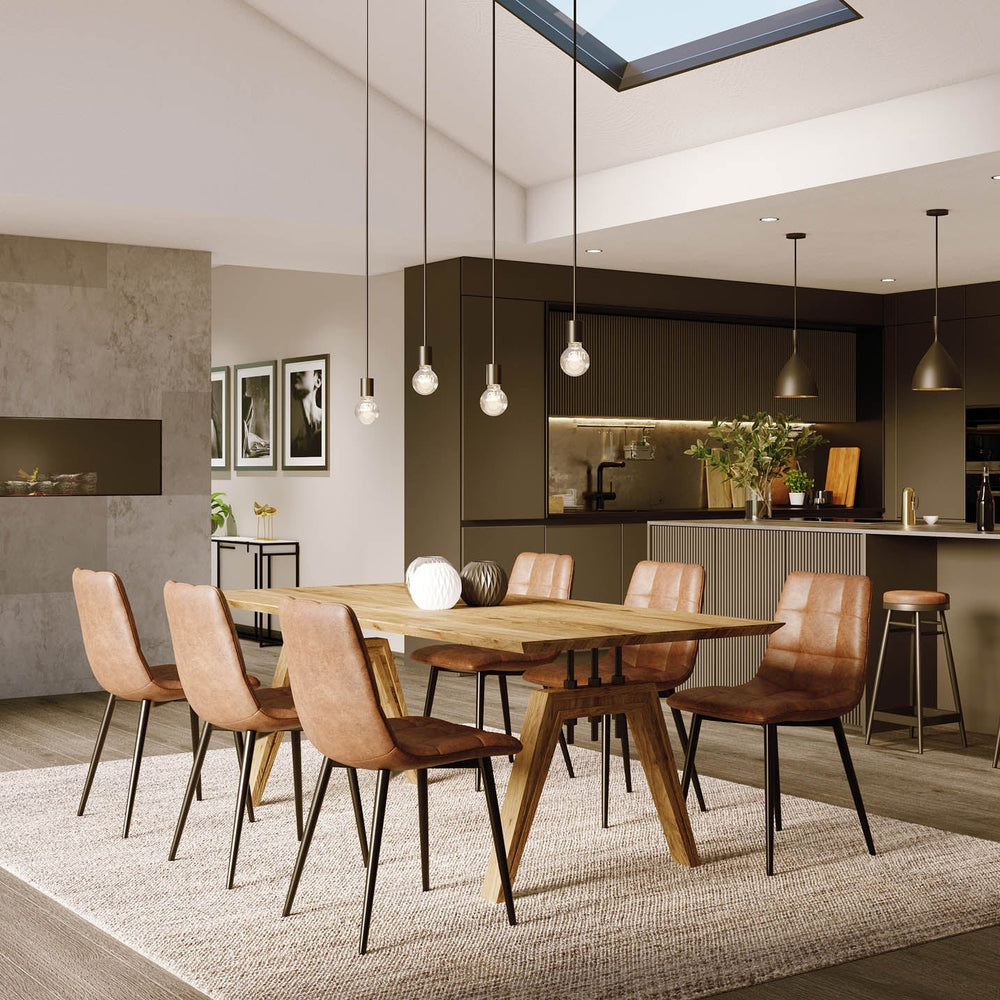 Modern kitchen and dining area with wooden table and chairs.